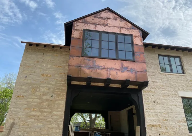 Copper metal panel facade on a stone building for Metal Roof Coating in Wahoo